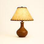 Vintage Style Brown Wood Table Lamp with Tapered Stem and Stitched Suede Shade